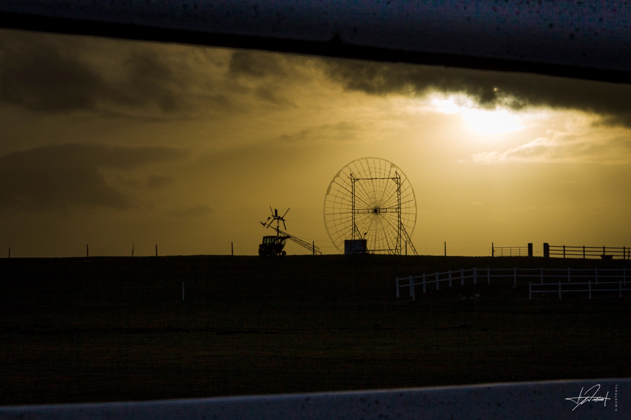Radar dish and tractor at dusk, Ireland